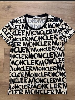 THE MONCLER THAT ENTERED THE ROOM FIRST